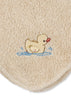The Konges Sloejd Organic Cotton Baby Cloths (6 Pack) features soft beige terry cloths made from organic cotton, each adorned with a charming embroidered yellow duckling splashing water—outlined in brown with an orange beak. The embroidery is positioned near the rounded edge, making these cloths an adorable and practical addition to any nursery collection.