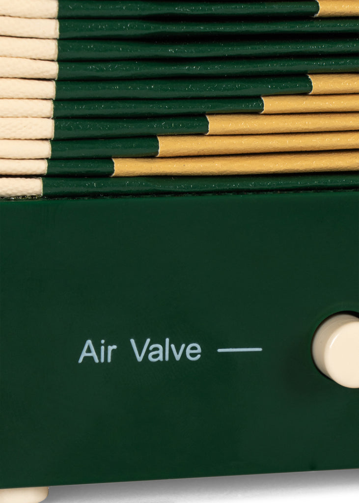 Close-up of a green Konges Sloejd Accordian showing the pleated bellows and a dial labeled “Air Valve.”