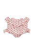 The Konges Sloejd Doll Carrier - Rosie Rose features soft pink cotton with red floral patterns, adjustable shoulder straps, and a waist strap, shown on a plain white background.