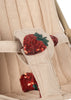 Close-up of the Konges Sloejd Doll Stroller - Strawberry, featuring a beige padded harness with red sequined strawberry appliqués, green leaves, and vertical quilting—a soft, stylish addition to any doll stroller or carriage bag with double wheels.