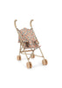 The Konges Sloejd Doll Stroller - Vienna features curved handles, beige and gold accents, floral-patterned removable fabric, and four double gold wheels, shown against a plain white background.