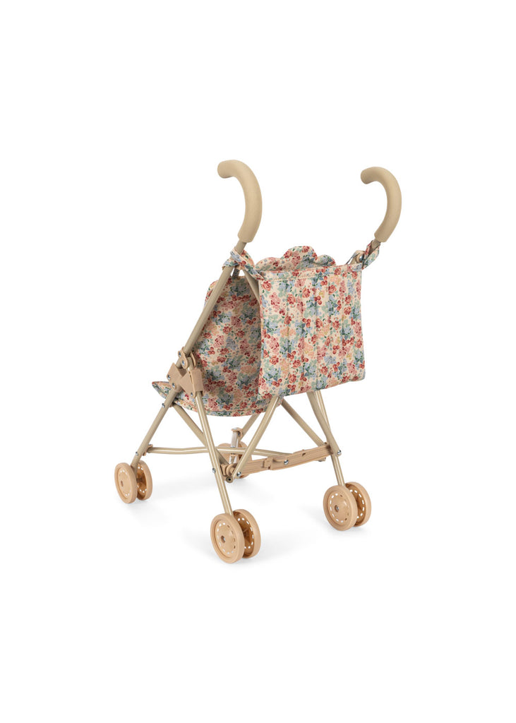 The Konges Sloejd Doll Stroller - Vienna features beige handles, double wheels, and a colorful floral-patterned removable seat. The empty stroller is showcased against a white background.