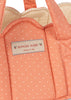 Close-up of the Konges Sloejd Doll Lift in the Rose Dot pattern, featuring a peach-colored, polka-dotted fabric with stitched handles. The label reads “Konges Sloejd cherry on top” and displays two small cherry illustrations. Crafted from soft, OEKO-TEX certified cotton, this charming doll lift ensures safety and comfort for little ones.