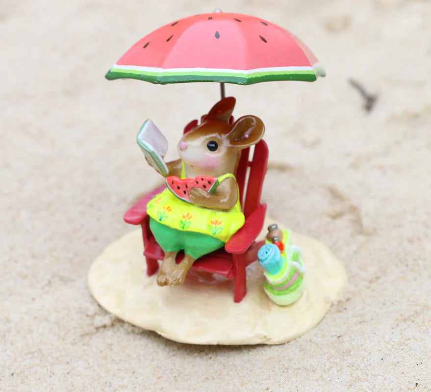 The Wee Forest Folk Tiny Collectible - Perfect Beach Day! features a hand sculpted mouse on a red chair under a watermelon umbrella, reading with a watermelon slice and drink on sand.