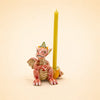 A small red Dragon Cake Topper with a yellow crown holds a yellow candle upright on a beige background, making it an enchanting handcrafted collectible perfect for any fantasy lover.