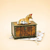 A Horse Cake Topper, offered as a final sale item, rests atop a small wooden chest with gold accents and a brass lock, which sits on a star-patterned cloth.