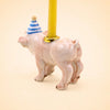 Pig Cake Topper - Final Sale: A charming ceramic pig figurine wearing a blue-striped party hat and carrying a yellow candle on its back, set against a plain beige background—a delightful handcrafted collectible and whimsical keepsake birthday decoration.
