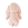 A soft, pink Cuddle + Kind Baby Bunny hand-knit stuffed rabbit toy viewed from the back, featuring floppy ears and a small circular tail, isolated on a white background.