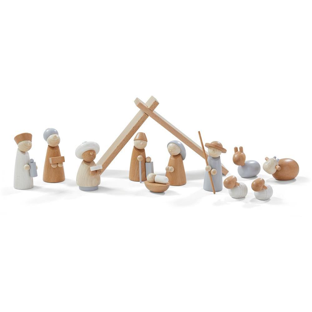 A Wooden Nativity Scene featuring figures representing Mary, Joseph, baby Jesus, an angel, two animals, and a simple stable with a cross on top, set against a plain white background.