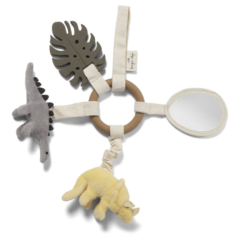 Baby's hanging dinosaur activity ring with an organic cotton activity ring, featuring a plush gray dinosaur, a yellow dinosaur, a green leaf-shaped teether, and a small mirror, all attached with fabric straps on.