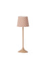 A tall, elegant Maileg Miniature Floor Lamp - Tall with a beige base and stem, featuring a lampshade adorned with a pattern of small orange polka dots against a light background.