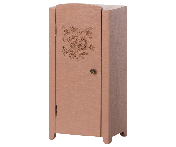 A tall, narrow pink Maileg Miniature Closet with printed details on the door and a small round knob, standing against a white background.