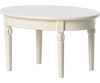 A simple, round, cream-colored Maileg Miniature Dining Table with four slightly tapered legs, presented on a white background.