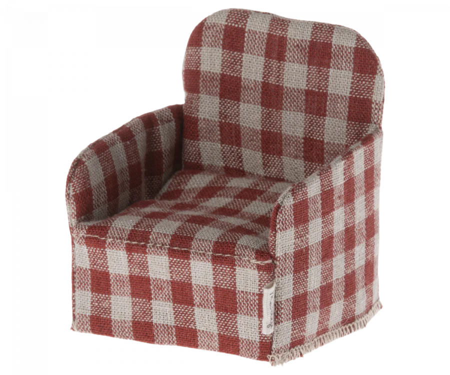 A cozy Maileg Plaid Chair upholstered in a red and white checkered fabric against a transparent background.
