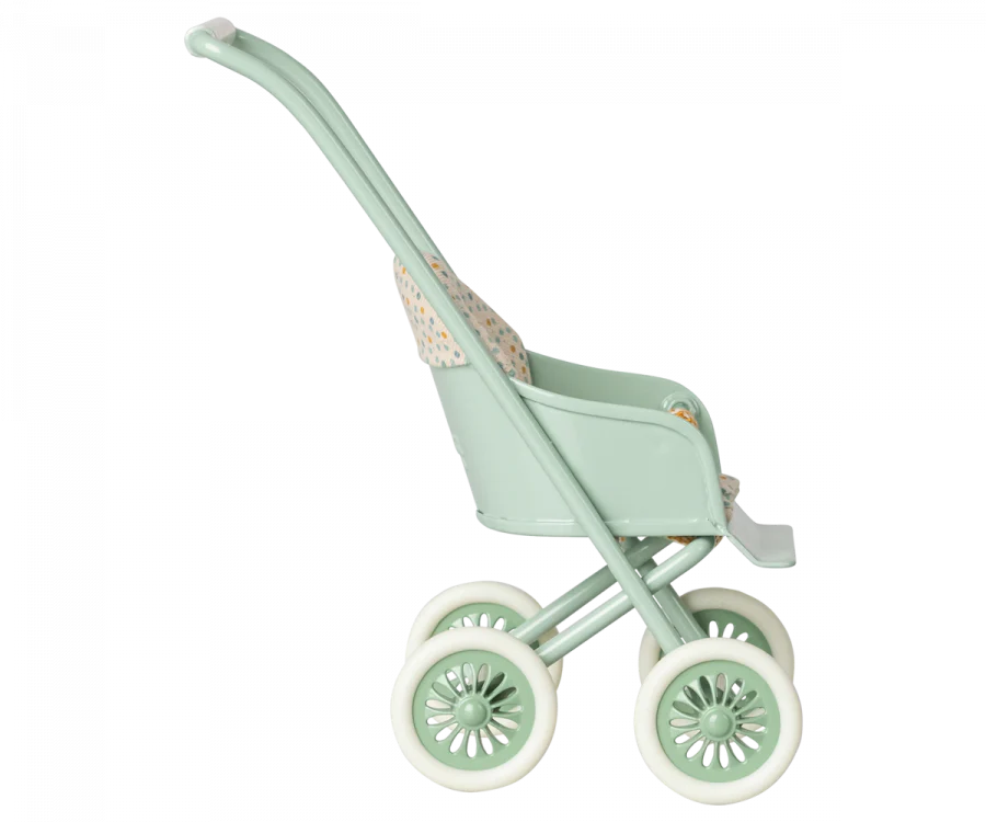 A Maileg Miniature Stroller, Micro - Mint with a high handle, large spoked wheels, and a dotted pattern on the seat, isolated on a white background.