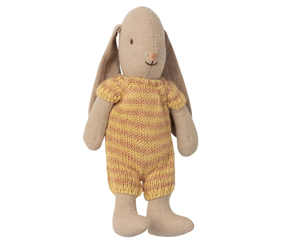 A Maileg Micro Bunny plush toy wearing a striped suit, standing upright with long droopy ears and a gentle smile.