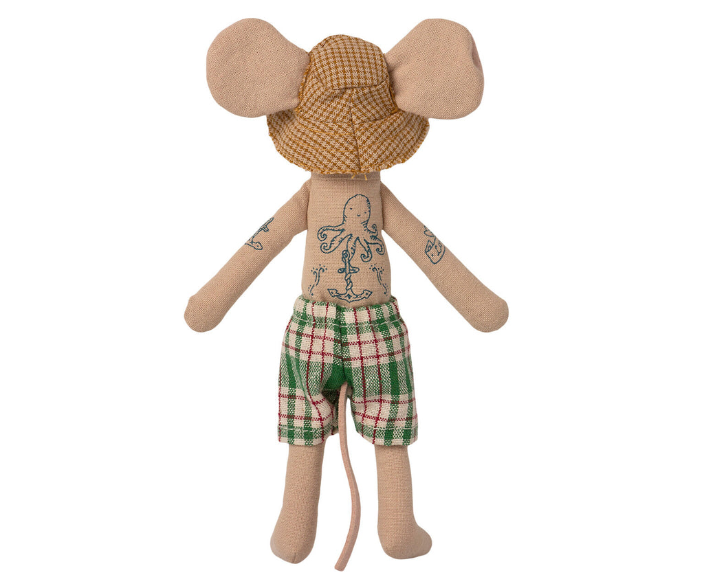 A Maileg Beach Mouse - Dad with large ears covered in houndstooth pattern, a detailed octopus tattoo on its torso, and wearing green plaid swim trunks, standing upright against a white background.
