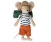 A Maileg Hiker Mouse, Big brother dressed in a striped shirt, durable orange pants, and a checkered hat, equipped with a green backpack, standing upright.