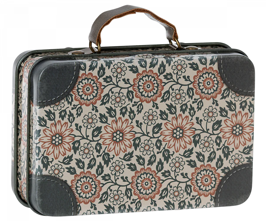 Maileg Suitcase, Small – This metal suitcase features a brown handle and is decorated with a charming floral pattern of red, white, and green flowers and leaves. Its dark gray reinforced corners add extra durability, making it perfect for gift storage or carrying small soft toys.