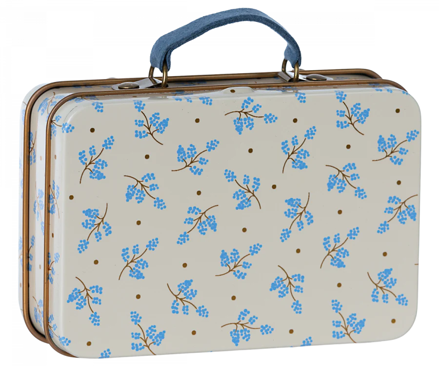 The Maileg Suitcase, Small is a rectangular metal case featuring a blue handle, a cream background adorned with small brown dots, and blue floral branch patterns—ideal for gift storage or keeping small soft toys.