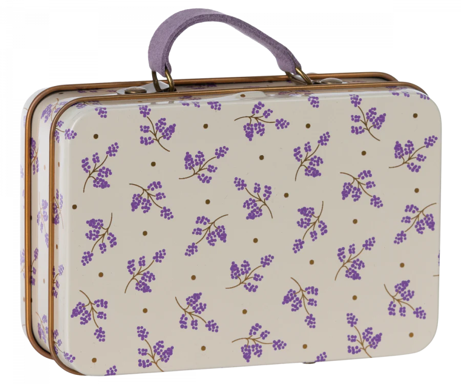 The Maileg Suitcase, Small is a rectangular metal case with a purple handle, designed with a cream background adorned with purple floral patterns and brown dots—perfect for storing gifts or carrying small soft toys.