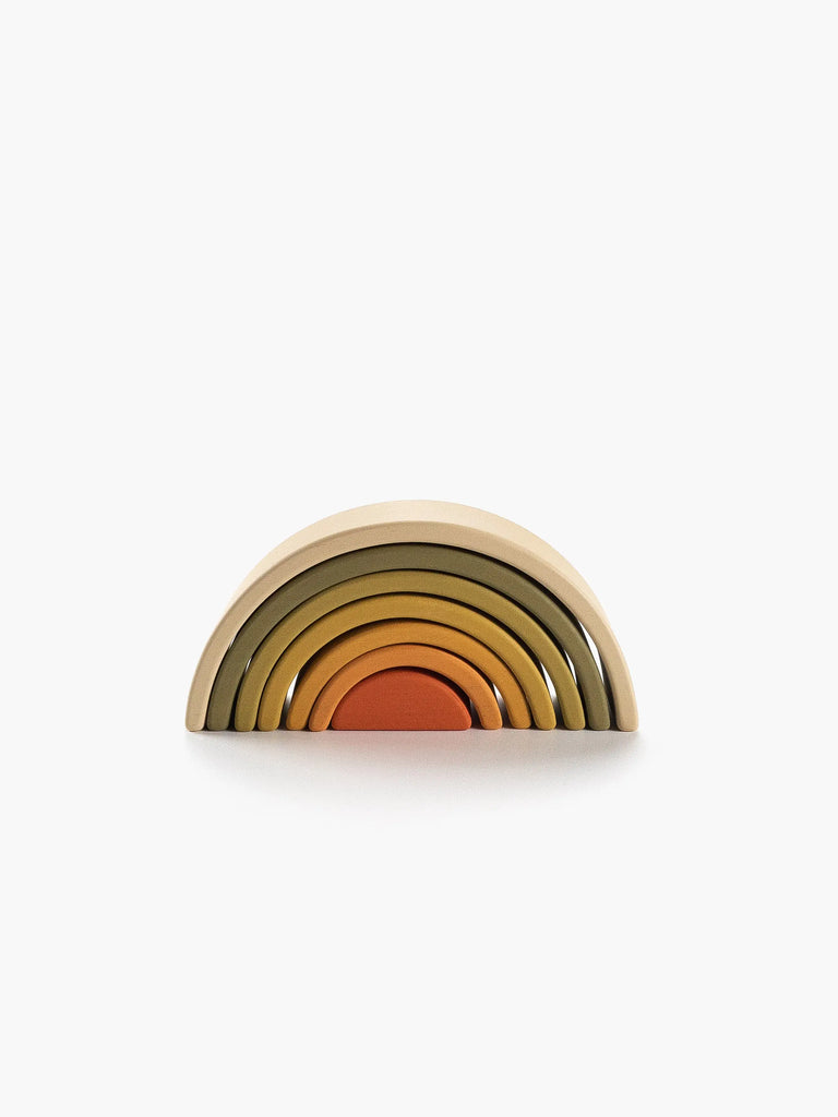 A set of Handmade Mini Rainbow Stackers - Flower Meadow, painted with non-toxic paint in gradient shades from natural wood to deep orange, symmetrically stacked to form a semicircle, isolated on a white background.