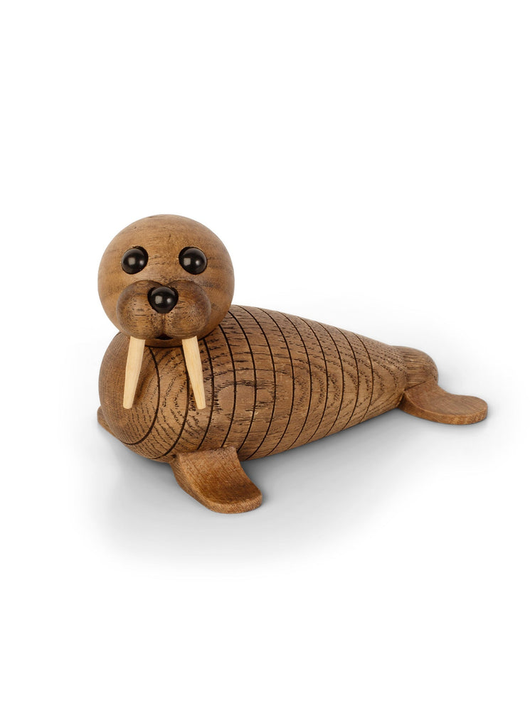 A Spring Copenhagen Wally handmade wooden dachshund toy with articulated, segmented body on a white background. The toy has large, round black eyes and prominent ears.