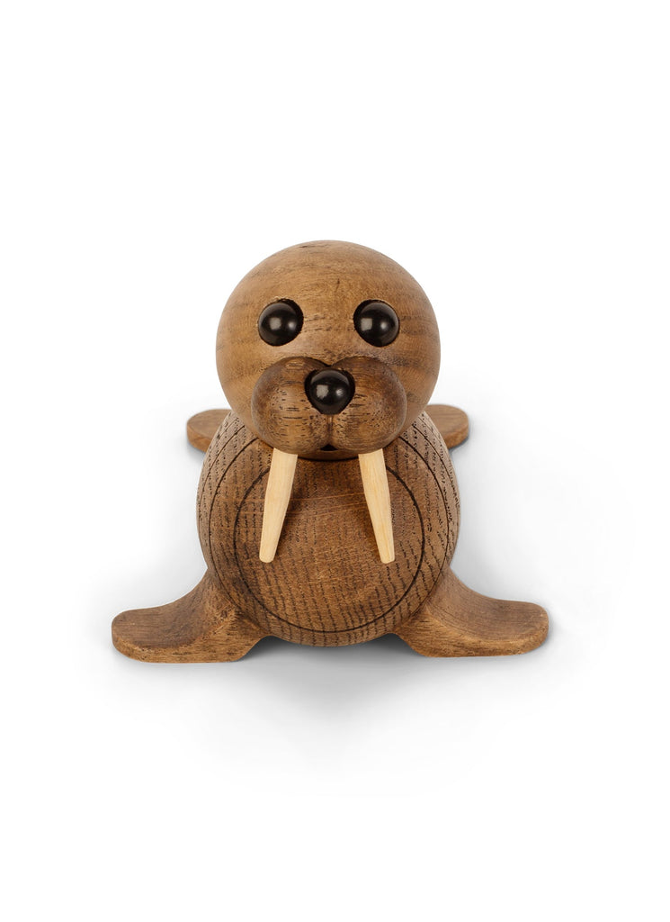 A handmade Spring Copenhagen Wally with round black eyes and protruding tusks, sitting on a plain white background. It features a charming, simple design with visible wood grain.