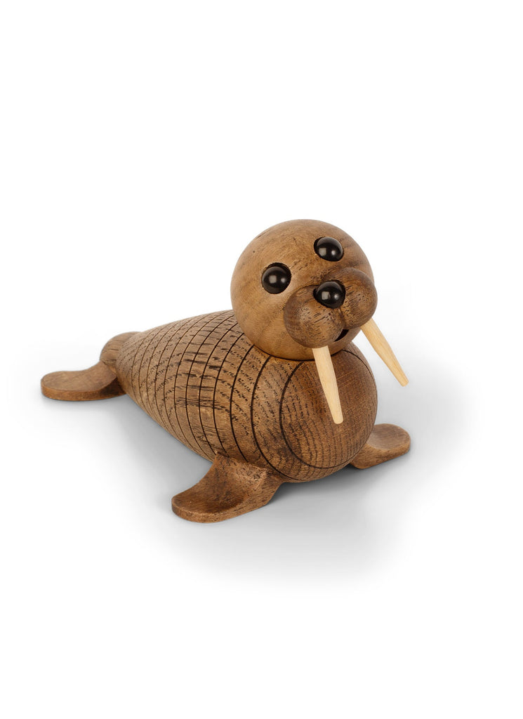 A Spring Copenhagen Wally with a spherical head, large round eyes, and whiskers made from small sticks, all crafted from wood and positioned on a white background.