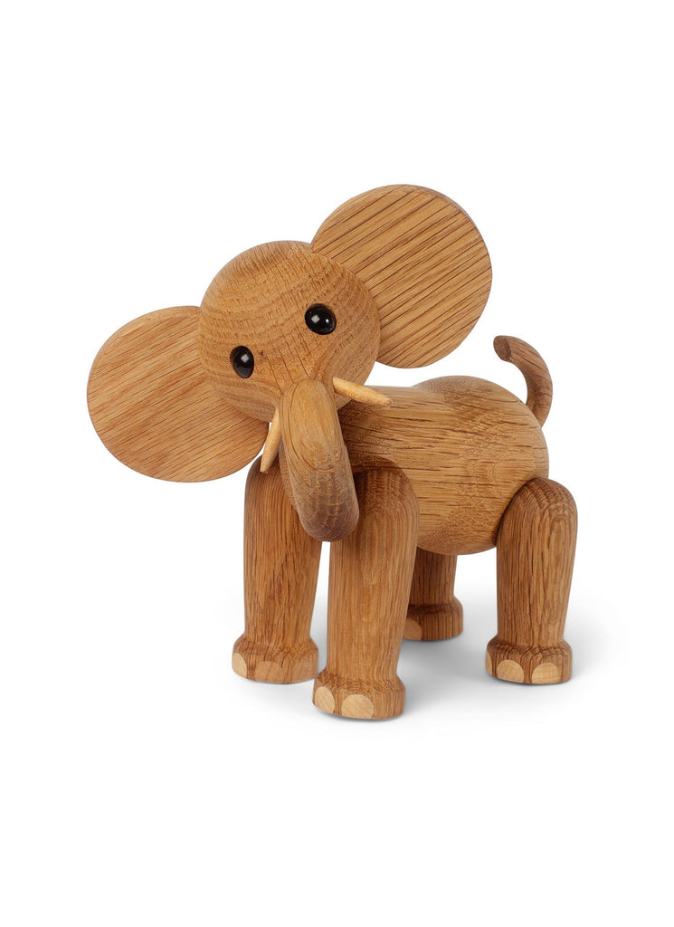 A Spring Copenhagen Ollie - Elephant figure crafted from FSC Oak, with large ears and a long trunk, standing isolated on a white background. The toy features visible natural wood grain texture.