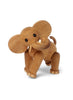 A Spring Copenhagen Ollie - Elephant figure with articulated joints and a natural FSC Oak grain texture, standing isolated on a white background. Its trunk is curled up and it appears playful.