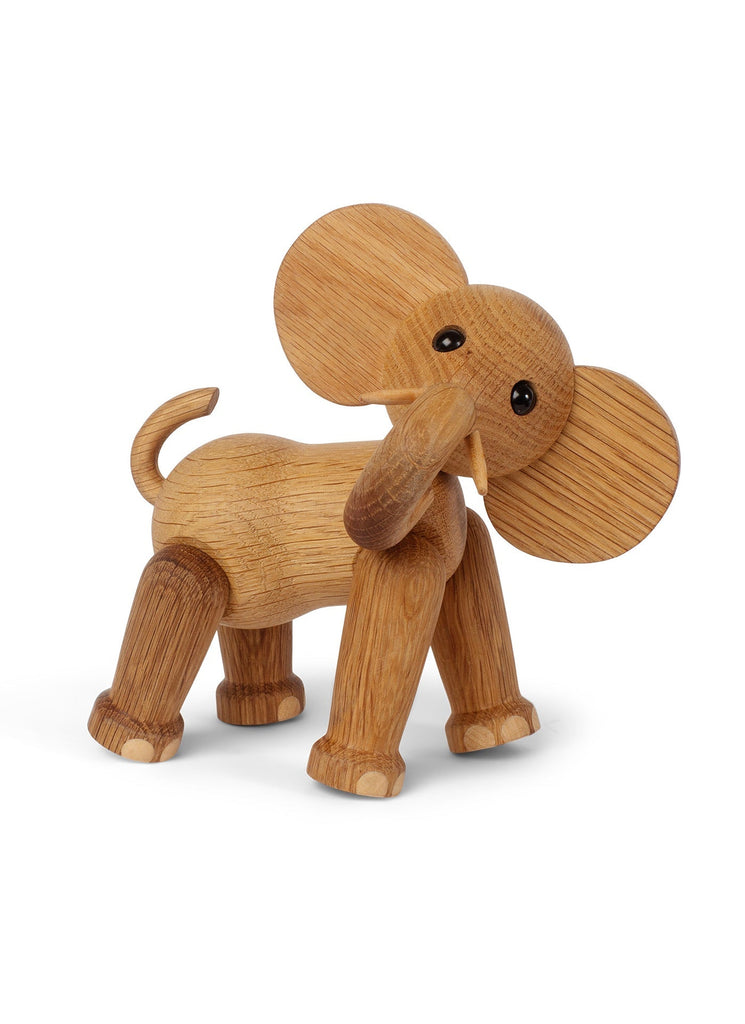A Spring Copenhagen Ollie - Elephant crafted from FSC Oak, with large, circular ears and a trunk extending forward, standing against a white background. Its body features visible wood grain textures.