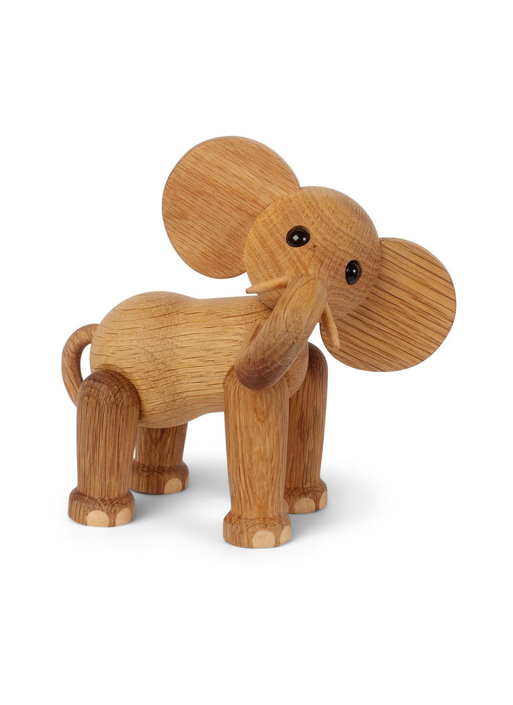 The Spring Copenhagen Ollie - Elephant with large round ears and eyes, crafted from FSC Oak, stands against a white background. Its body displays detailed wood grain textures.