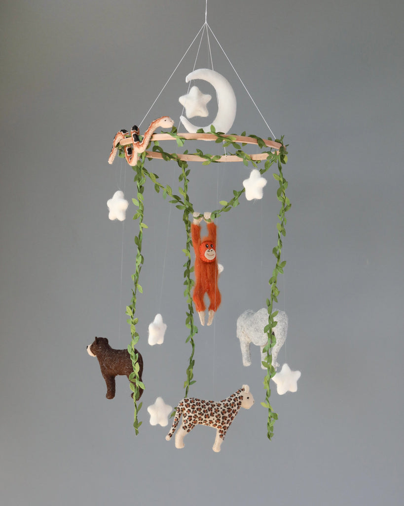 A Handmade Mobile - In The Jungle - Final Sale featuring plush animals and green vines against a gray background; includes a giraffe, elephant, sloth, and others dangling amidst clouds and a crescent moon.