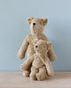 Two Senger Naturwelt Stuffed Animal - Bears, one larger and one smaller, sitting together against a soft blue background. The larger bear has its arm around the smaller one in a comforting embrace.
