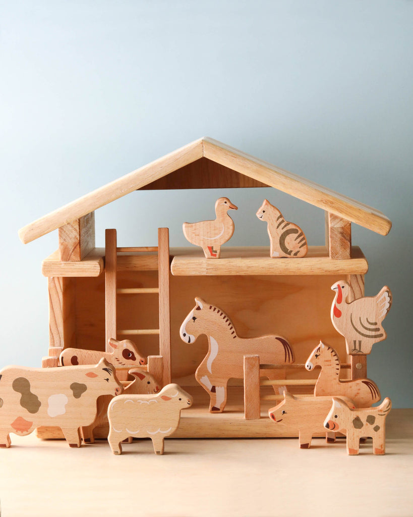 wooden farm animals toy set in a barn