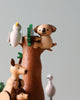 A delightful scene from Wooden Australian Safari Park Music Box featuring wooden animal figurines made from sustainably sourced wood: a koala perched on a tree, a kangaroo beside it, and a bird atop the.