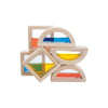 Sentence with product name: A set of five Wooden Water Blocks, each with a colorful translucent window in the center in shapes such as squares, triangles, and semicircles, stacked asymmetrically against a white background.
