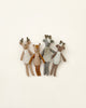 Four deer stuffed animals photographed on a flat background.