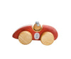 A Handmade Wooden Toy Race Car painted red with natural wooden wheels and a gray driver's cap. Made from sustainably harvested birch wood, the car features a white circle on its side with the number 1 painted in blue. The toy is simple in design and photographed on a white background.