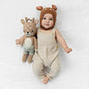 Baby with fawn stuffed animal