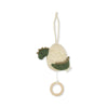 A Lullaby Activity Pull Toy - Dinosaur with a cracked egg design. The beige egg reveals a green, lambswool-textured baby dino. It features a string and wooden ring for hanging and pulling, making it perfect for playing "Twinkle Twinkle Little Star.