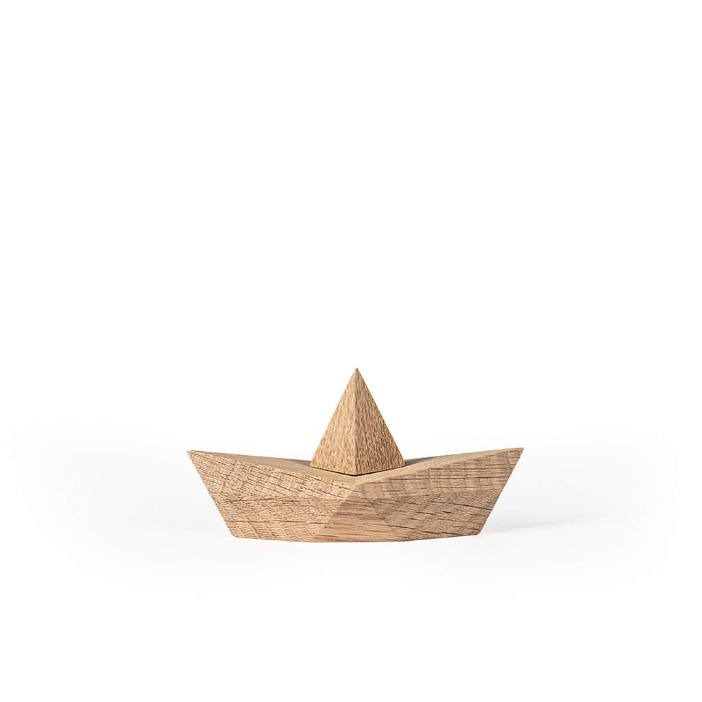 A textured, Boyhood Admiral, Small Oak boat on a white surface, casting a subtle shadow beneath, with a clean and minimalist background.