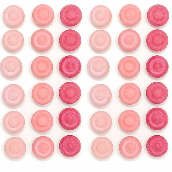 A grid-like arrangement of various shades of pink lipstick swatches, inspired by the colors of Grapat Mandala Flowers, on a white background.