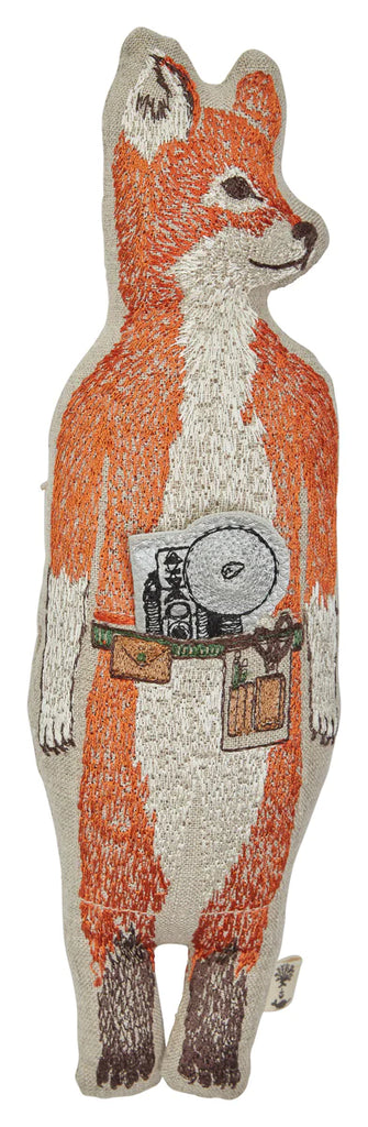 Embroidered fabric Coral & Tusk Fox Pocket Doll, standing upright and depicted as a photographer with a camera and leather bag. The fox is detailed in orange, white, and black threads, holding strawberries instead of a