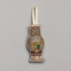 The Coral & Tusk Owl Ornament, with intricate embroidery in brown, gold, and green threads, brings a festive forest theme to life. It hangs from a beige ribbon against a plain gray background, perfect for adding charm to your Christmas collection.