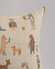 Coral & Tusk Woodland Friends Pillow with illustrations of various animals like bears, foxes, foraging chipmunks, and owls in playful poses on a light beige fabric.