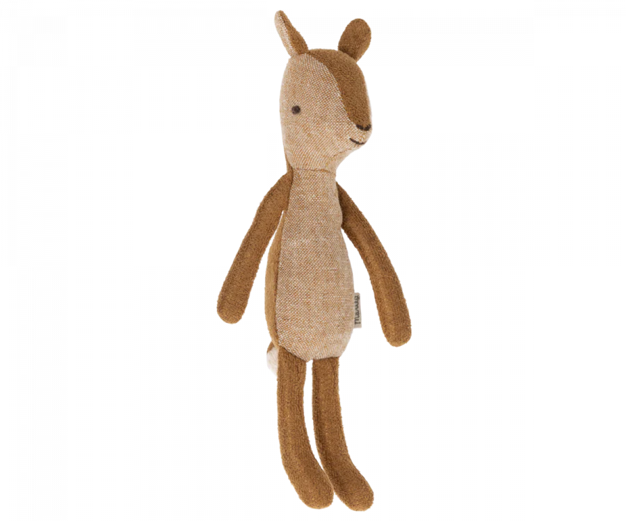 A small deer stuffed animal photographed on a flat background.