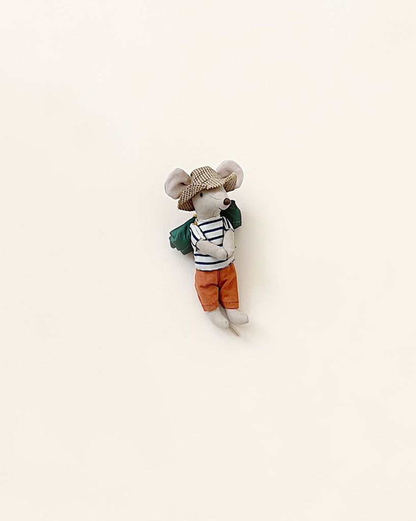 A small, stylish Maileg Hiker mouse plush toy dressed in a green coat and striped shirt, with a gray hat, against a plain white background.