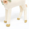 Close-up of a Meri Meri Blossom Baby Deer Stuffed Animal with a cream body and gold hooves, featuring an embroidered flower detail on its side.